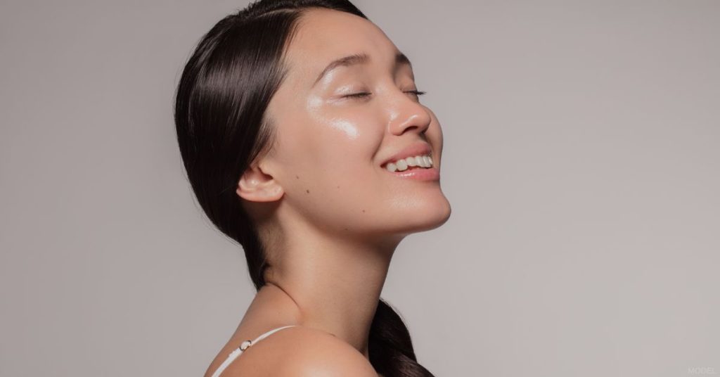 Woman with clear dewy skin (model)