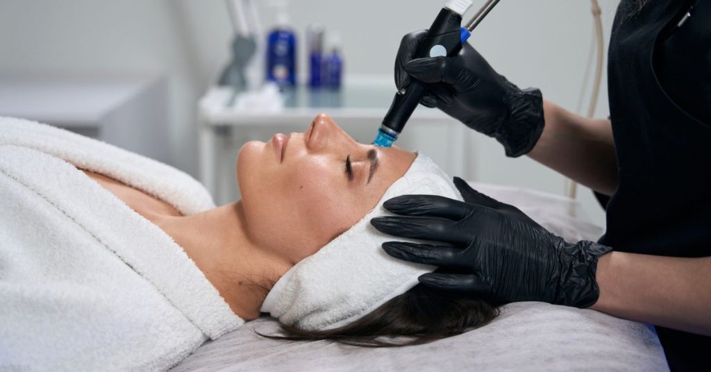 Woman receiving a HydraFacial (models)