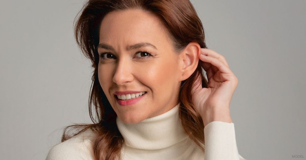 Woman showing off her skin post laser skin resurfacing (model)