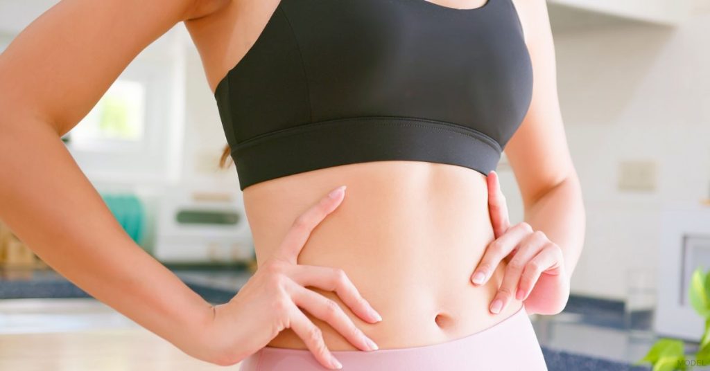 Woman recovering from her CoolSculpting treatment at home (model)