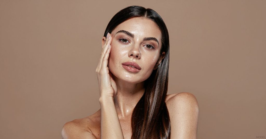 Woman with plump skin after filler treatments (model)